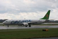 5B-DBR @ EGCC - Taken at Manchester Airport on a typical showery April day - by Steve Staunton