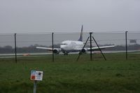D-ABIO @ EGCC - Taken at Manchester Airport on a typical showery April day - by Steve Staunton