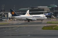 D-ABIO @ EGCC - Taken at Manchester Airport on a typical showery April day - by Steve Staunton