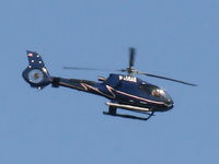 N455AE - On a fine day, rich tourists buzz around the Manhattan skyline like flies to an outhouse.  No sightseers on board this bird; however, as it belongs to Uncle Sam. - by Daniel L. Berek