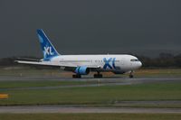 G-BOPB @ EGCC - Taken at Manchester Airport on a typical showery April day - by Steve Staunton