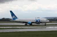G-BOPB @ EGCC - Taken at Manchester Airport on a typical showery April day - by Steve Staunton