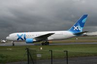 G-BOPB @ EGCC - Taken at Manchester Airport on a typical showery April day - by Steve Staunton