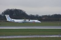 G-ECOC @ EGCC - Taken at Manchester Airport on a typical showery April day - by Steve Staunton