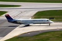 N779CA @ CID - Taxiing to Runway 9 for departure