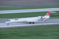 N922XJ @ CID - Taxiing to the gate on Alpha after sunset - by Glenn E. Chatfield