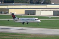 N927CA @ CID - Over the numbers on Runway 27