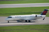 N927CA @ CID - Taxiing across runway 13/31 on Alpha