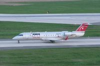 N8837B @ CID - Taxiing to the gate on Alpha after sunset
