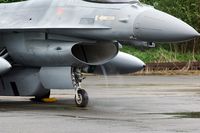 FA-108 @ EBBE - Under wet circumstances the F-16 develops a small tornado in the intake sucking up the water from the taxiway. - by Joop de Groot