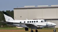 N821CB @ TTA - At rest - by John W. Thomas