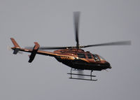 N515JW - Flying East over Columbine Highschool in formation with helicopter N83700 - by Bluedharma