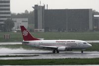 4L-TGA @ EHAM - Georgian 737 on a wet afternoon at Amsterdam
