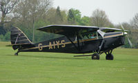 G-AIYS @ EGBK - Lady pilot carefully looking after this classic Leopard Moth - by Terry Fletcher