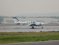 N1847F @ KBDL - Airnet pulling into thr Tac Air ramp during some morning showers - by Nick Michaud
