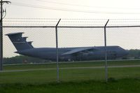 70-0447 @ FFO - C-5A parked on the ramp, as seen from the road through the fence - by Glenn E. Chatfield