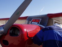 N9129E - Ken checking oil at fly in @ Ponca city Ok.