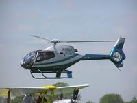 G-DRLH @ EGBK - EC120 landing at Sywell, note Tiger Moth G-ALIW in foreground