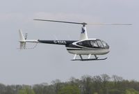 G-EDES @ EGSN - R44 landing at Bourn - by Simon Palmer