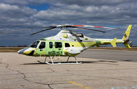 N56157 @ CYHD - Stopping in YHD for fuel, on its way to YVR to be shipped to Korea to her new owners. This is the last Bell 430 to be produced. SN# 49129. - by DJKennedy