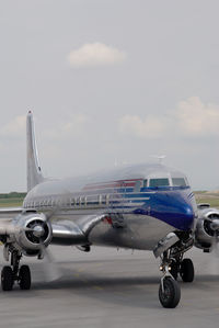 N996DM @ VIE - Red Bull DC6 - by Yakfreak - VAP