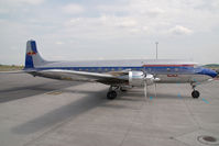 N996DM @ VIE - Red Bull DC6 - by Yakfreak - VAP
