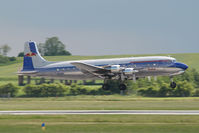 N996DM @ VIE - Red Bull DC6 - by Yakfreak - VAP