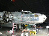 N1042B @ FTW - Getting some well earned love at the home base - Vintage Flying Museum hanger - by Zane Adams