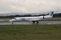 G-ERJE @ EGCC - Taken at Manchester Airport on a typical showery April day - by Steve Staunton