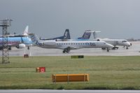 G-ERJF @ EGCC - Taken at Manchester Airport on a typical showery April day - by Steve Staunton