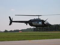 N304HP @ HBI - hovering - by Tom Cooke