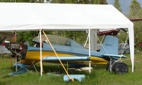 N1053Y @ AK28 - A Miller TM-5 under cover of a tent at Chena Marina , Fairbanks - by Terry Fletcher