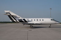 UR-CCB @ VIE - Falcon 20