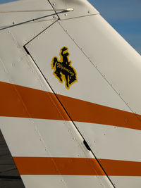 N7675G @ CXP - Close-up 1973 Cessna 150L with Wyoming cowboy tail logo @ Carson City, NV - by Steve Nation