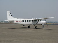N97826 @ STS - All-white 2006 Cessna 208B with FLIR pod in VERY hazy conditions @ Santa Rosa, CA - by Steve Nation