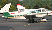 N9117W @ KCDW - A 1966 Cherokee tries to blend in with its stablemates. - by Daniel L. Berek