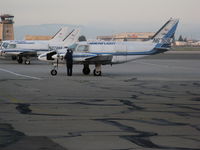 N6759L @ OAK - Early morning shot of Ameriflight 1970 piper PA-31-310 freighter getting windshield wiped  @ Oakland, CA - by Steve Nation