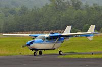 N1375L @ 5W8 - Arriving in the rain - by John W. Thomas