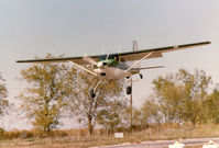 UNKNOWN @ 52F - Cessna 180 landing at the former Mangham Airport, North Richland Hills, TX
