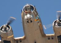 N93012 @ KFNL - Nine-O-Nine Flys over the Public area. Person in the front looks down. - by Bluedharma