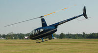 N38VB @ CGE - R-44 leaving Cambridge MD Airport - by J.G. Handelman