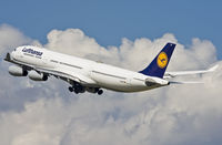 D-AIFF @ EDDL - Climbing from rwy 23L through impressive clouds. Main gear on the move. - by Philippe Bleus