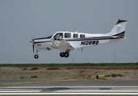 N128WB @ SQL - 2006 Raytheon G36 on final approach in smoky conditions @ San Carlos, CA - by Steve Nation