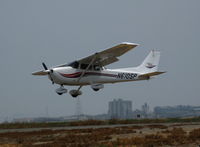 N610SP @ SQL - 2000 Cessna 172S shooting touch and goes in smoky conditions @ San Carlos, CA - by Steve Nation