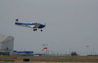 N8667H @ OAK - pseudo-USAF 1947 North American Navion landing in smoky conditions @ Oakland, CA - by Steve Nation