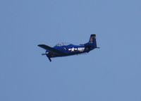 N328AK - Flying over West Littleton by Columbine Highschool in Littleton Colorado. USS Kittyhawk on tail.