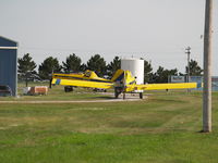 N50669 @ KAUH - ONE REFILLING PESTICIDES THE OTHER WAITING TO BE REFILLED - by Gary Schenaman