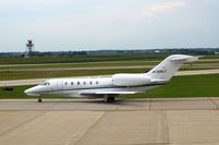 N701LX @ CID - Taxiing to Runway 27 for departure. - by Glenn E. Chatfield