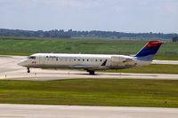 N925EV @ CID - Taxiing on Alpha to the ramp.  Looking through my dirty window.