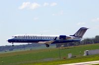 N593ML @ CID - Lifting off Runway 9 for ORD.  I kept the airplane level in the viewfinder so the ground is dropping